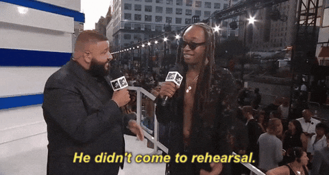 Dj Khaled standing with others